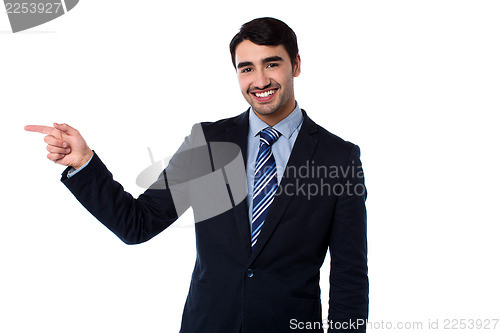 Image of Smart businessman pointing at something