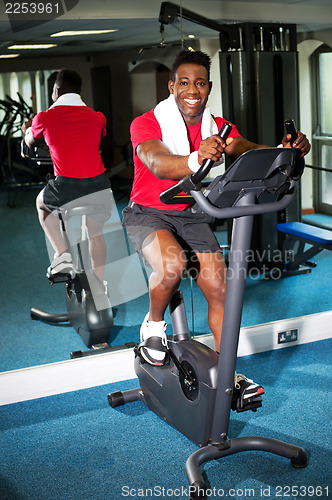 Image of Athletic young man at the gym