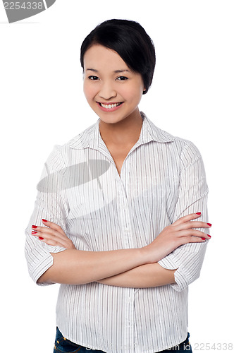 Image of Beautiful young asian girl, arms folded