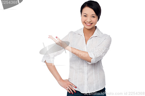 Image of Pretty casual woman directing the way