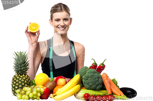 Image of The beautiful girl with fruits and vegetables