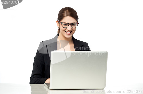 Image of Businesswoman working on laptop