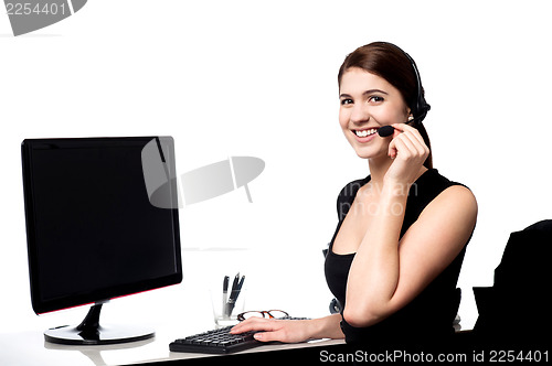 Image of Female executive assisting client over a call