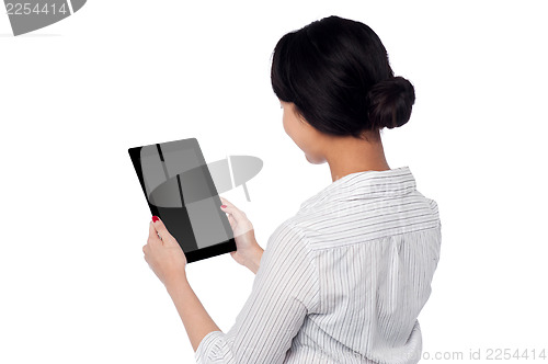 Image of Business woman operating touch pad device