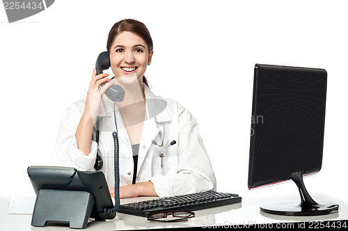 Image of Female physician answering phone call