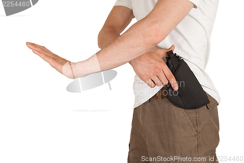 Image of Close-up of a man with holster and a gun