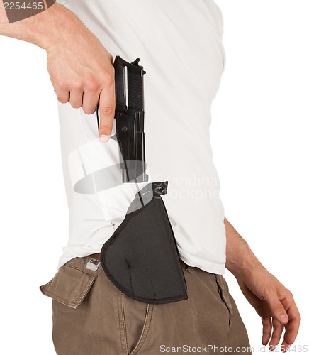 Image of Close-up of a man with holster and a gun