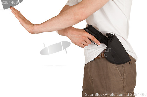 Image of Close-up of a man with holster and a gun