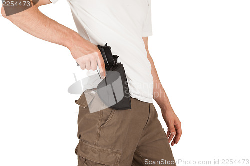 Image of Close-up of a man with holster and a gun