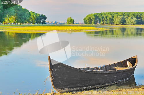 Image of alone fishing boat on danube river