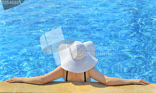 Image of Woman with  hat relaxing 