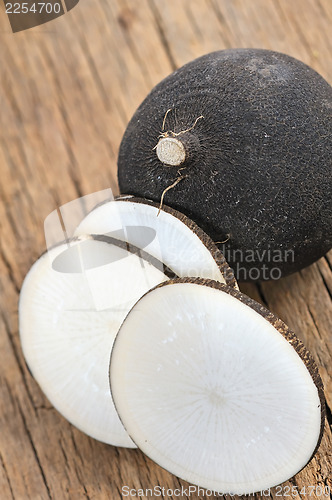 Image of Black radish on a wooden board