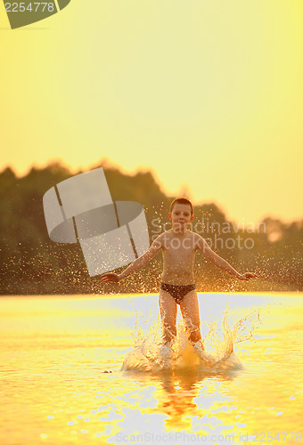 Image of boy jumping in river