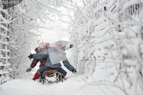 Image of Kids sliding in winter time