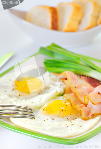 Image of breakfast with bacon and fried eggs 