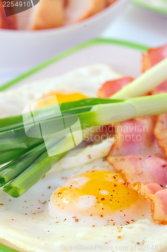 Image of  breakfast with bacon and fried eggs