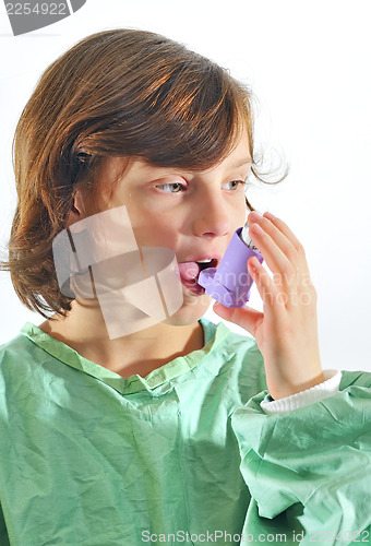 Image of little girl using inhaler