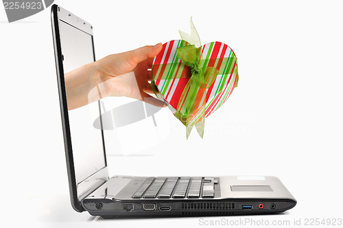 Image of gift come out from a screen of a laptop 