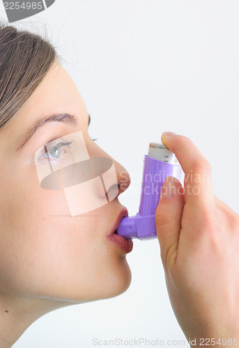 Image of girl using an inhaler for Asthma