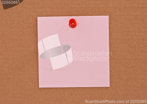 Image of Pink note paper attached with red pin