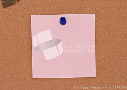 Image of Pink note paper attached with blue pin