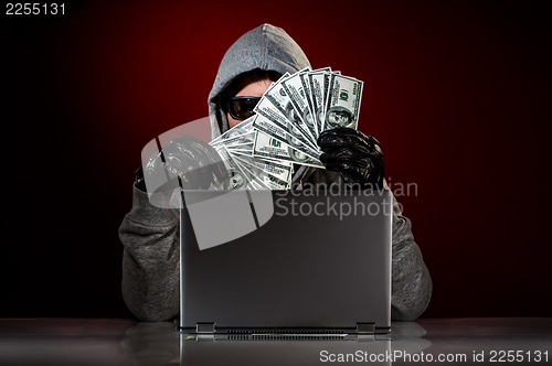 Image of Hacker and money