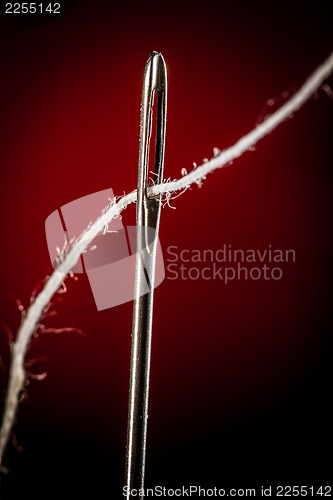 Image of Needle with thread