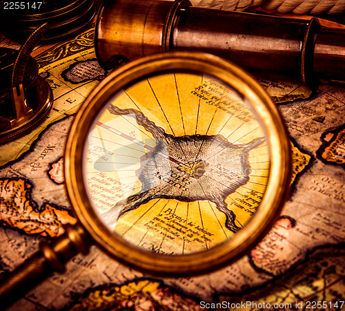 Image of Vintage magnifying glass lies on the ancient map of the North Po