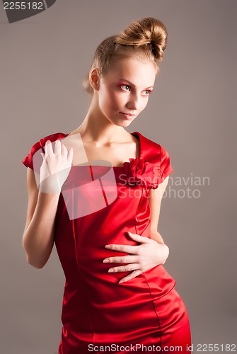 Image of sexy young blond woman in red