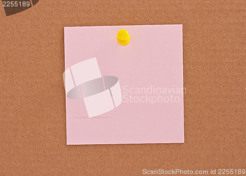 Image of Pink note paper attached with yellow pin