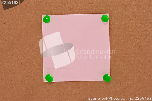 Image of Pink note paper attached with green pin