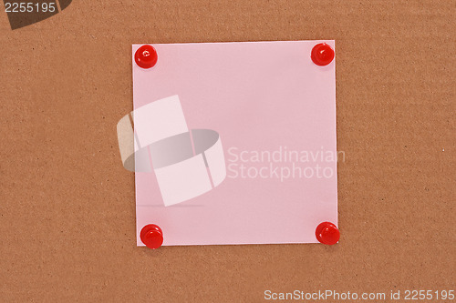 Image of Pink note paper attached with red pins