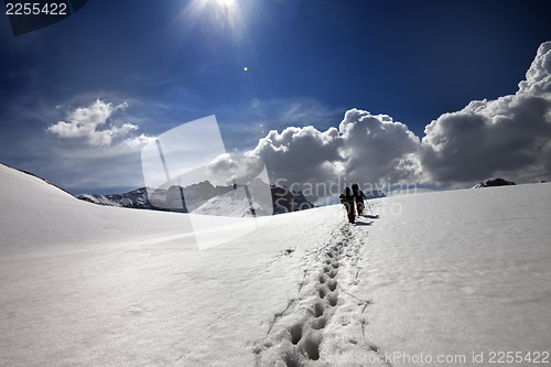 Image of Two hikers on snow plateau
