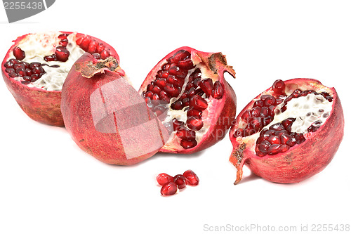 Image of Halved pomegranates isolated on white background