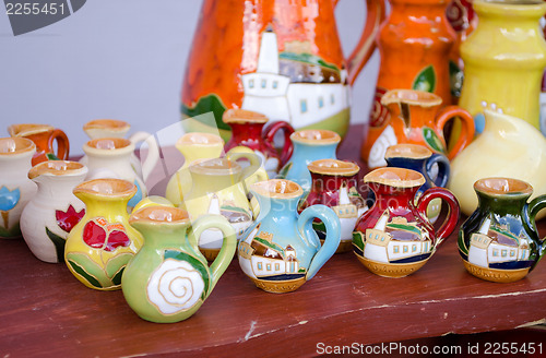 Image of various colorful clay handmade jug jar sell market 