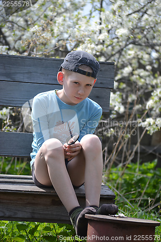 Image of the teenager with a magnifying glass