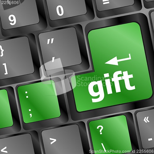 Image of Computer keyboard with gift key - holiday background