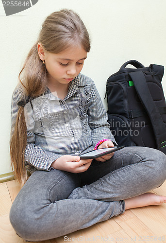Image of Girl reading e-book