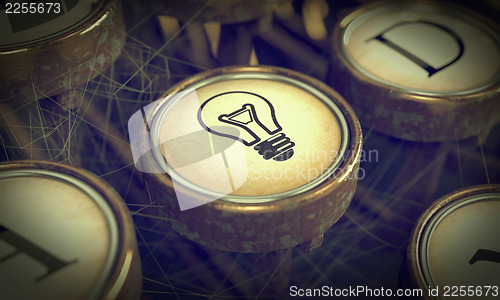 Image of Lamp Bulb Typewriter Key. Grunge Background.