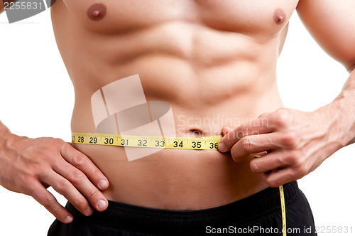 Image of Fit Man Measuring His Waist
