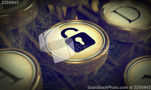 Image of Padlock on Grunge Typewriter Key.