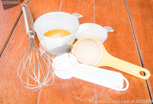 Image of Step of bakery preparation with milk, butter, spoon, hand mixer 