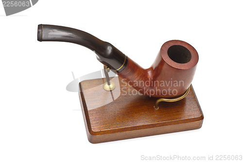 Image of Smoking pipe on stand, isolated