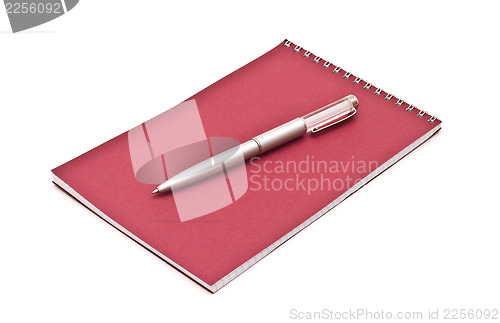 Image of Notebook with silver pen, isolated on white