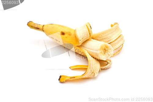 Image of Half-peeled banana on white background