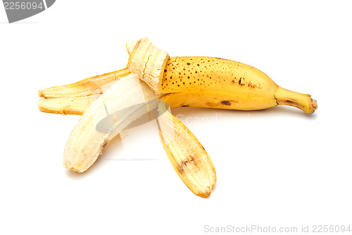 Image of Half-peeled banana on white background