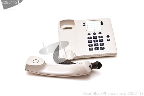 Image of Grey plastic telephone on white background