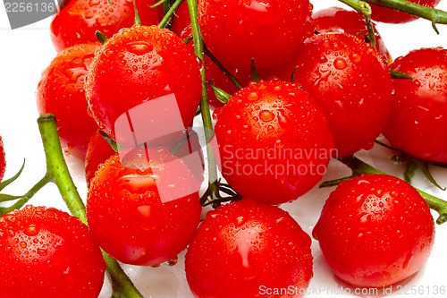 Image of Ripe cherry tomatoes on white background