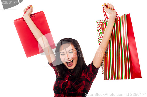 Image of Joyous young girl enjoying her shopping