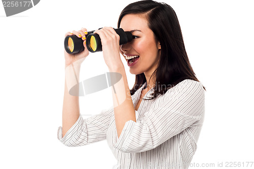 Image of Corporate woman viewing through binoculars